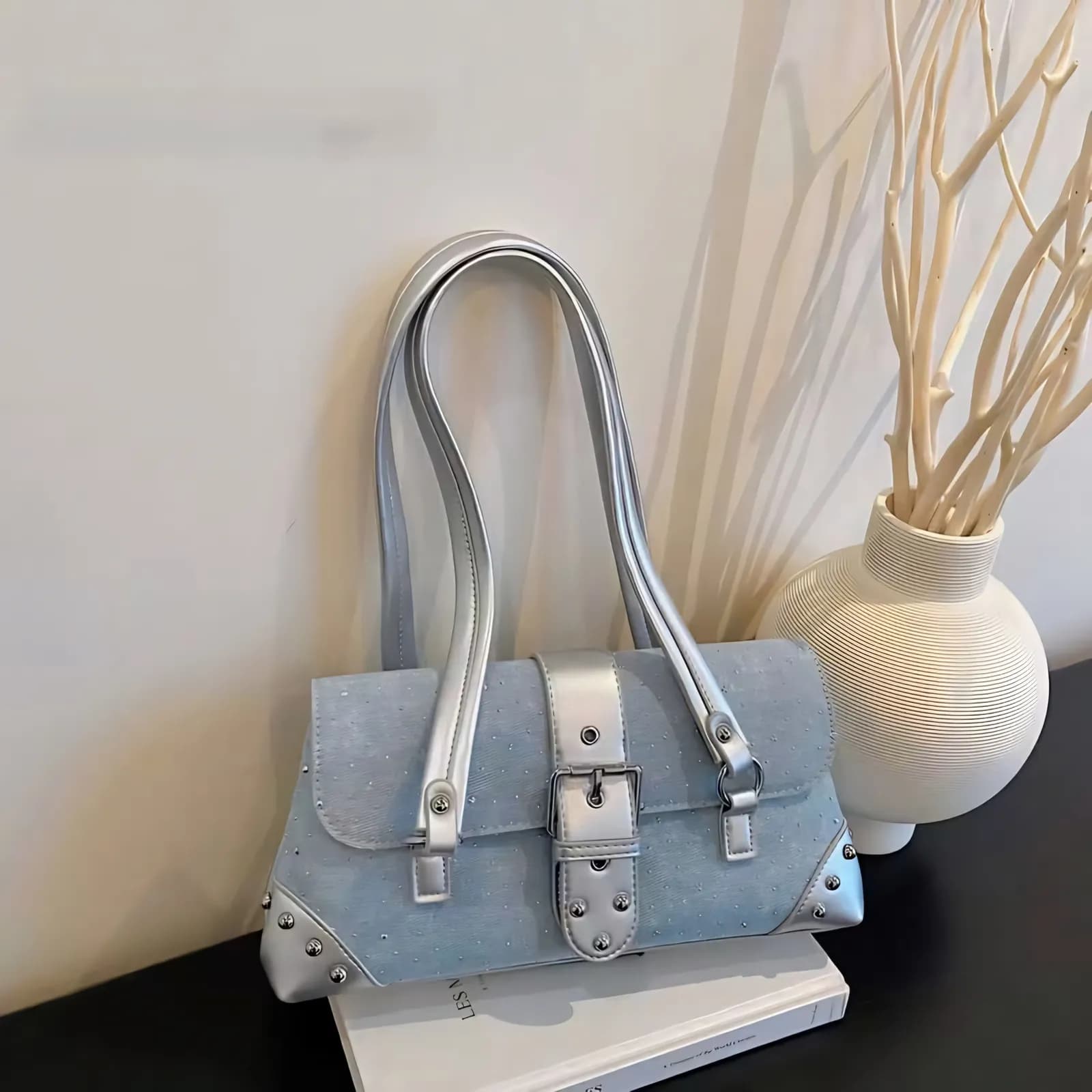 Light blue Y2K sparkle denim shoulder bag with silver buckle and studded corners