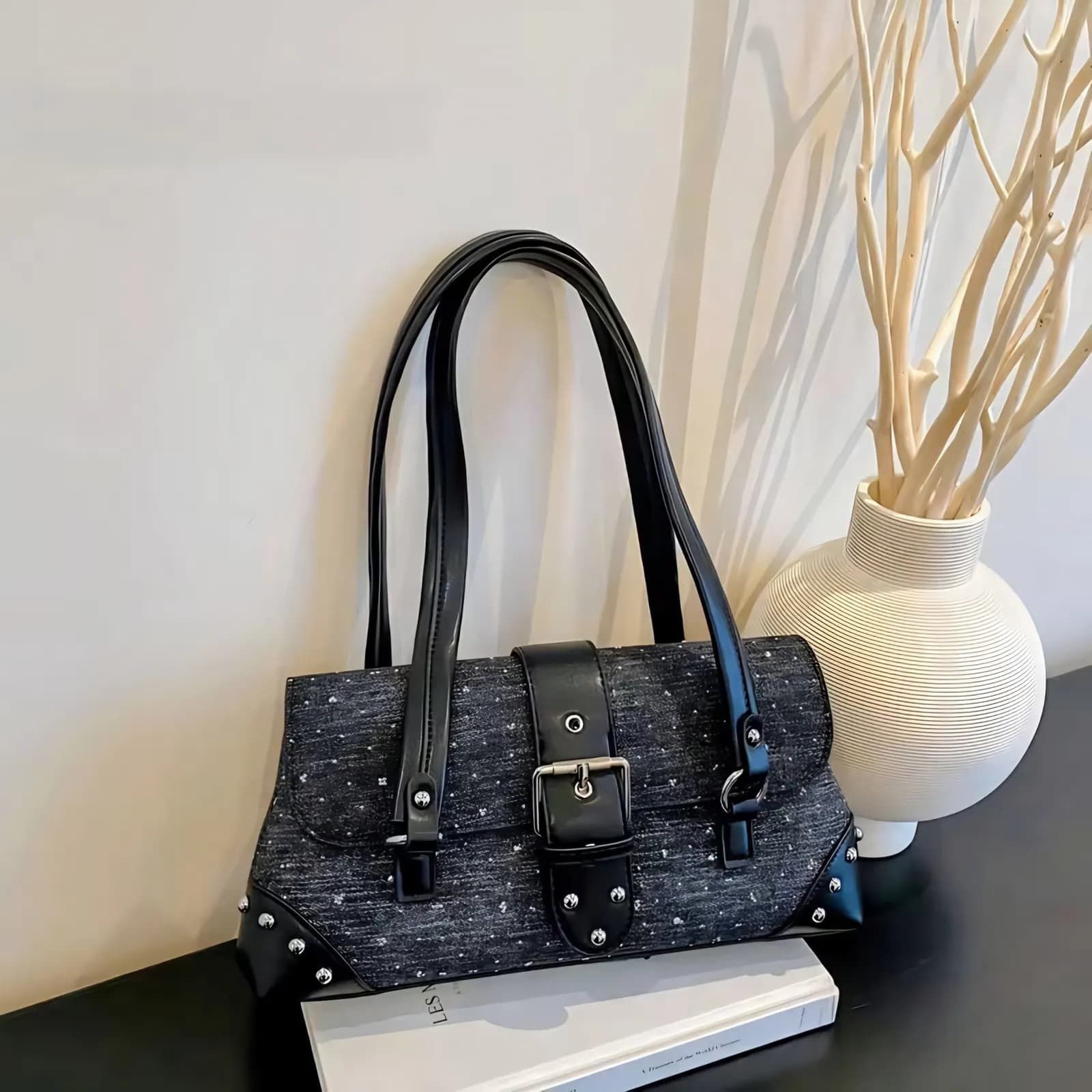 Black textured sparkle Y2K shoulder bag with black straps and silver buckle hardware