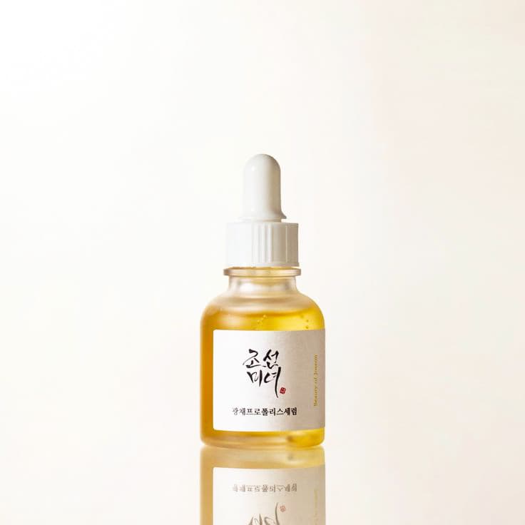 Honey-like serum texture glowing skin close-up